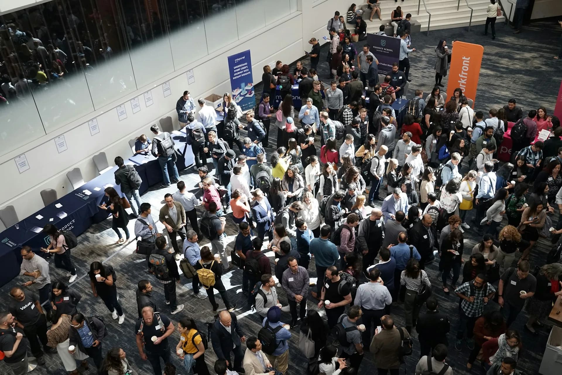 Crowd of people in a building lobby during an event
