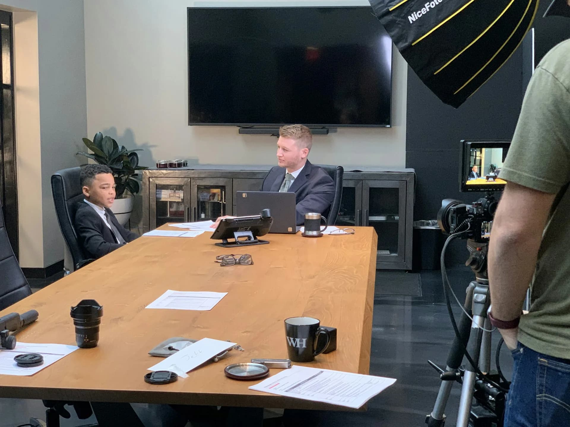 Person seated in a chair ready for a studio interview with professional lighting