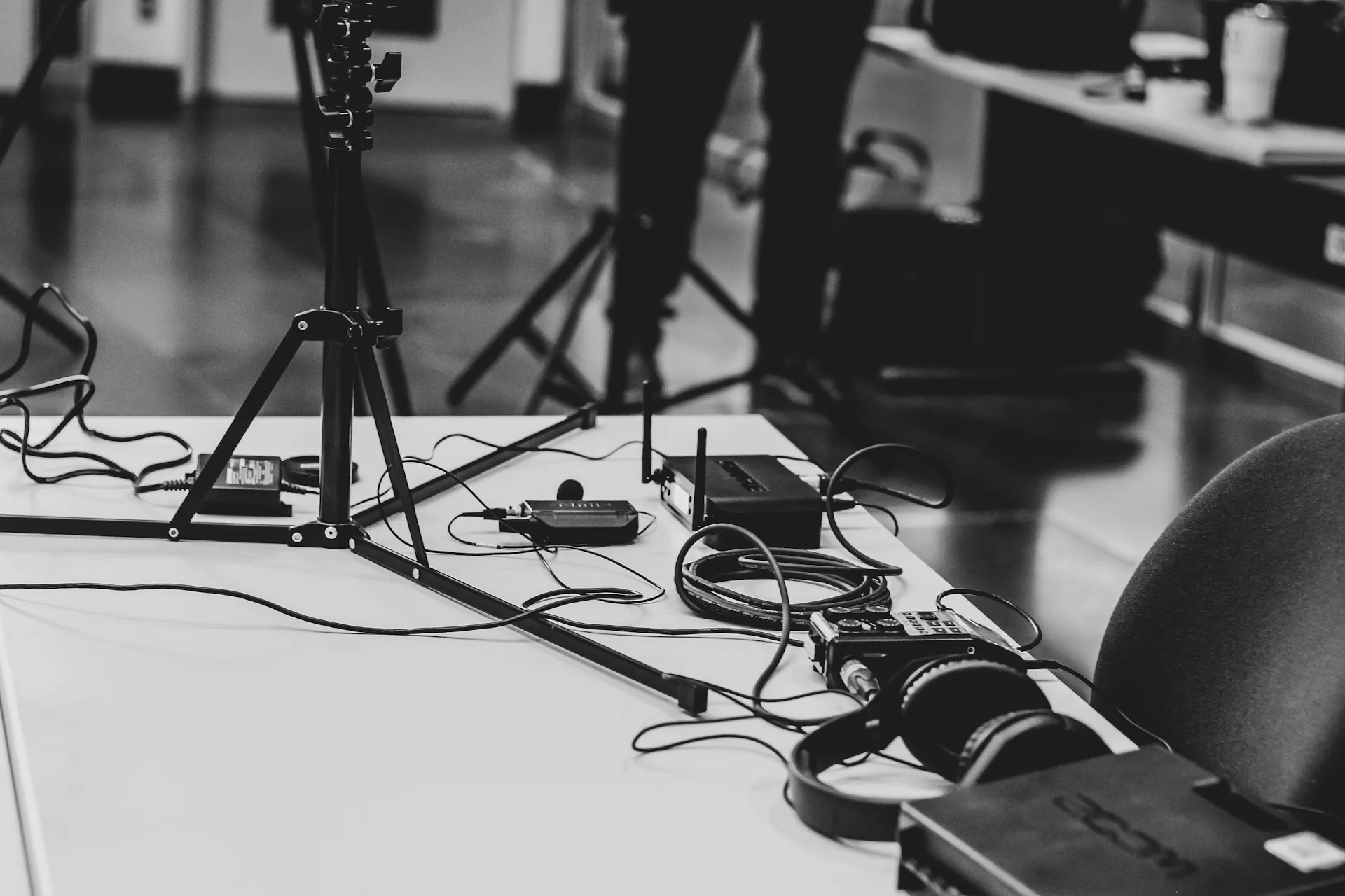 Production desk with headphones and a professional microphone for recording interview audio