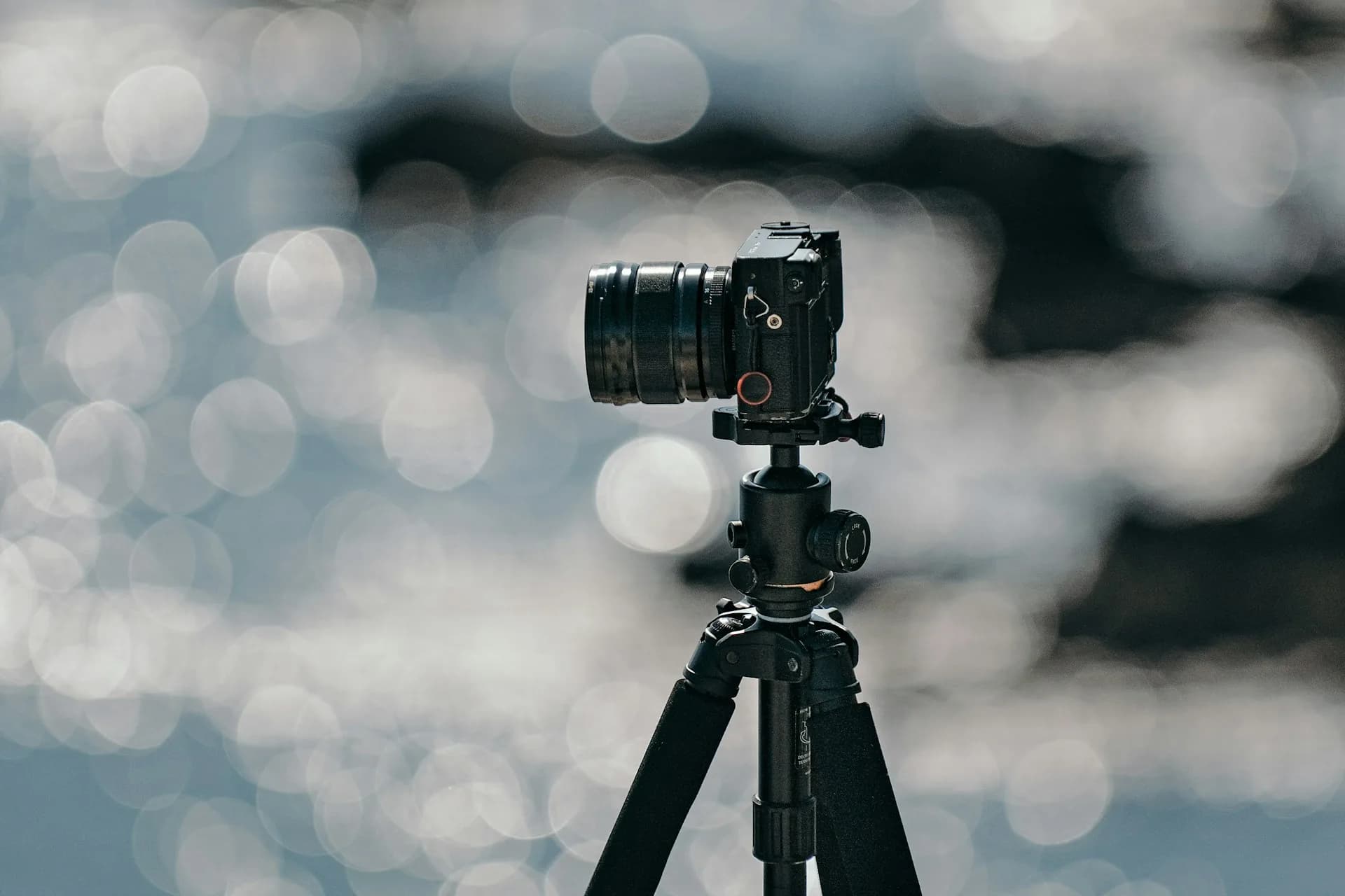 Black DSLR camera on a tripod