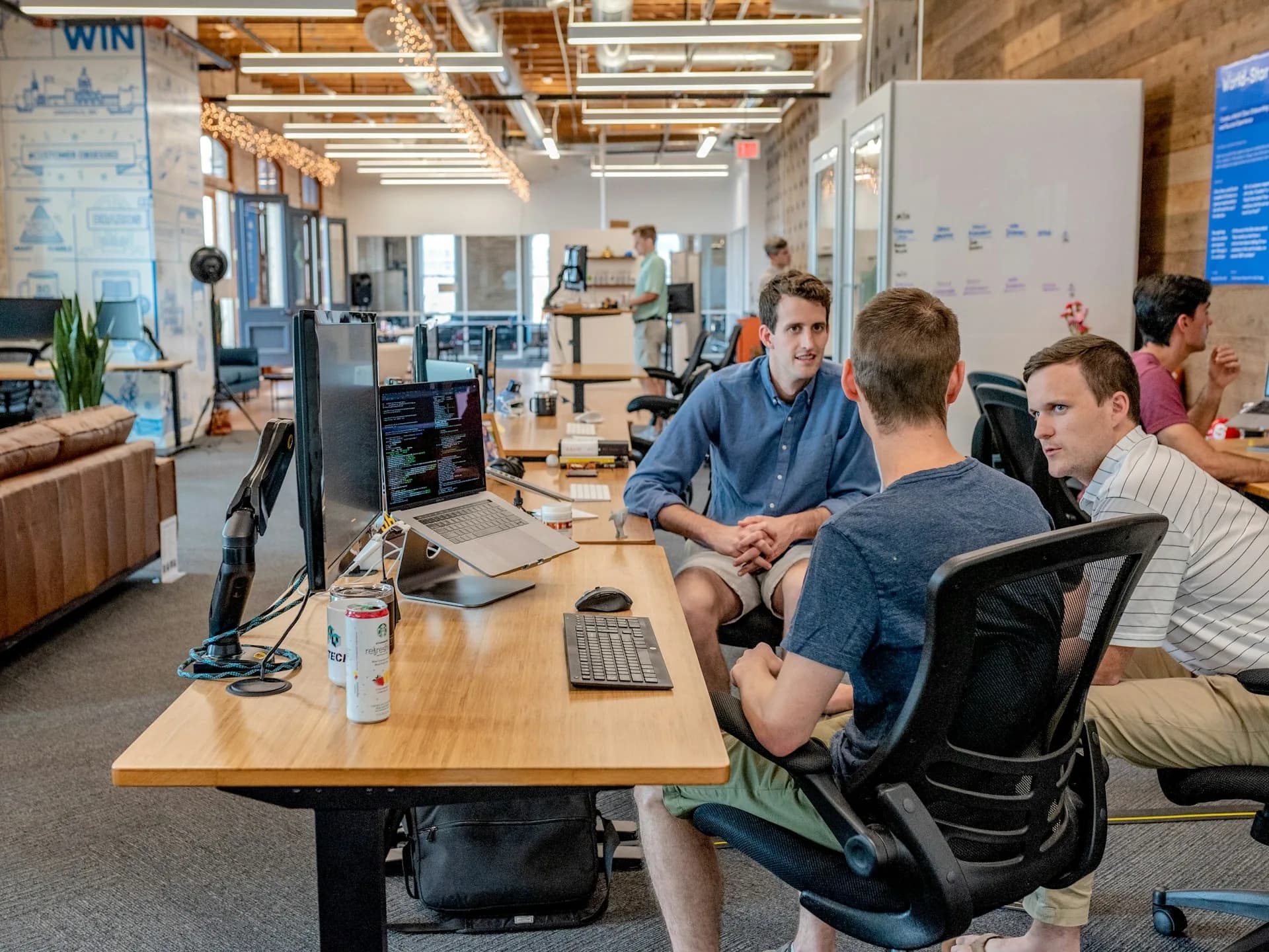 Three team members working in a startup office