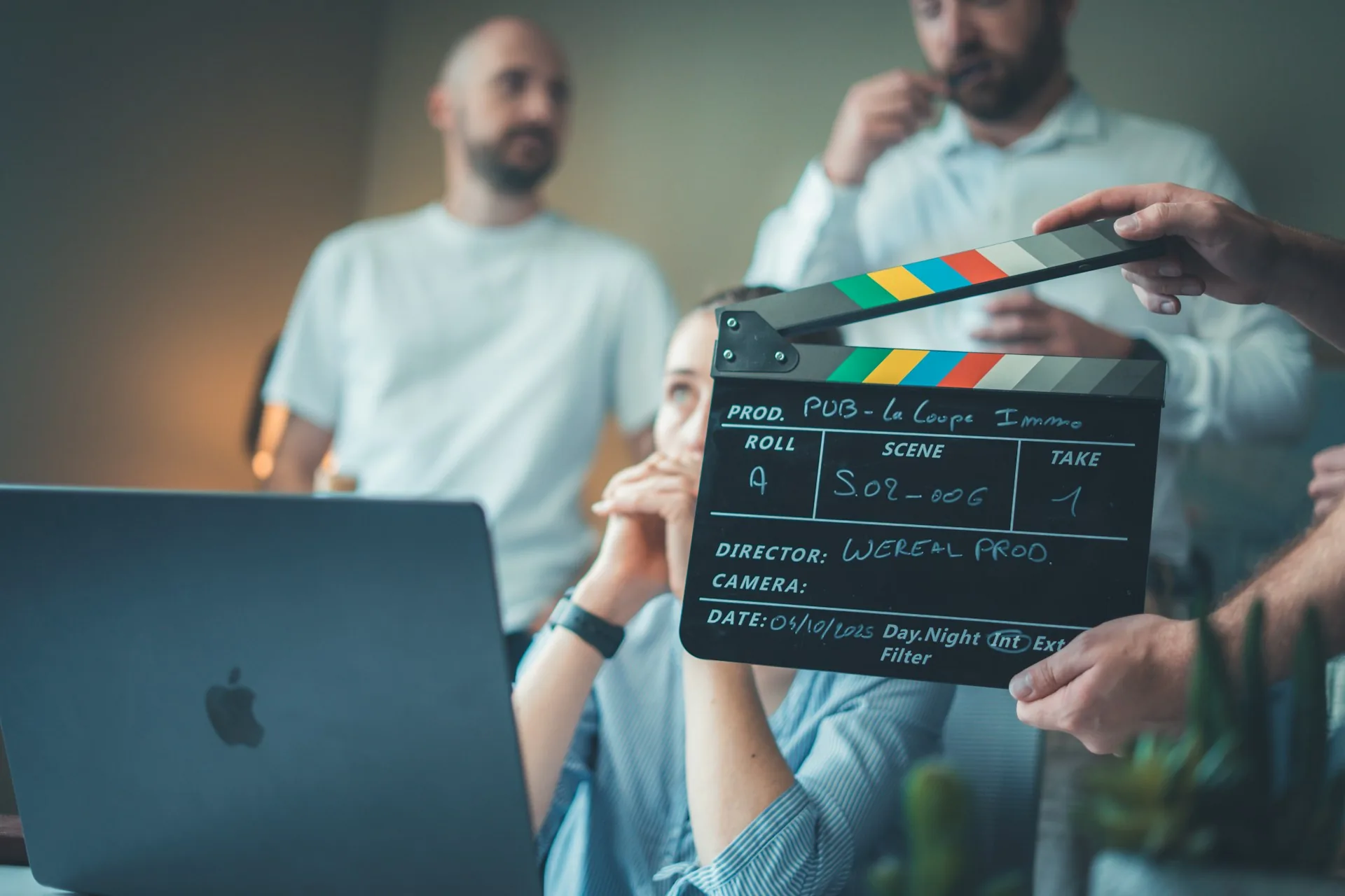 Film clapperboard and laptop on a professional brand video shoot